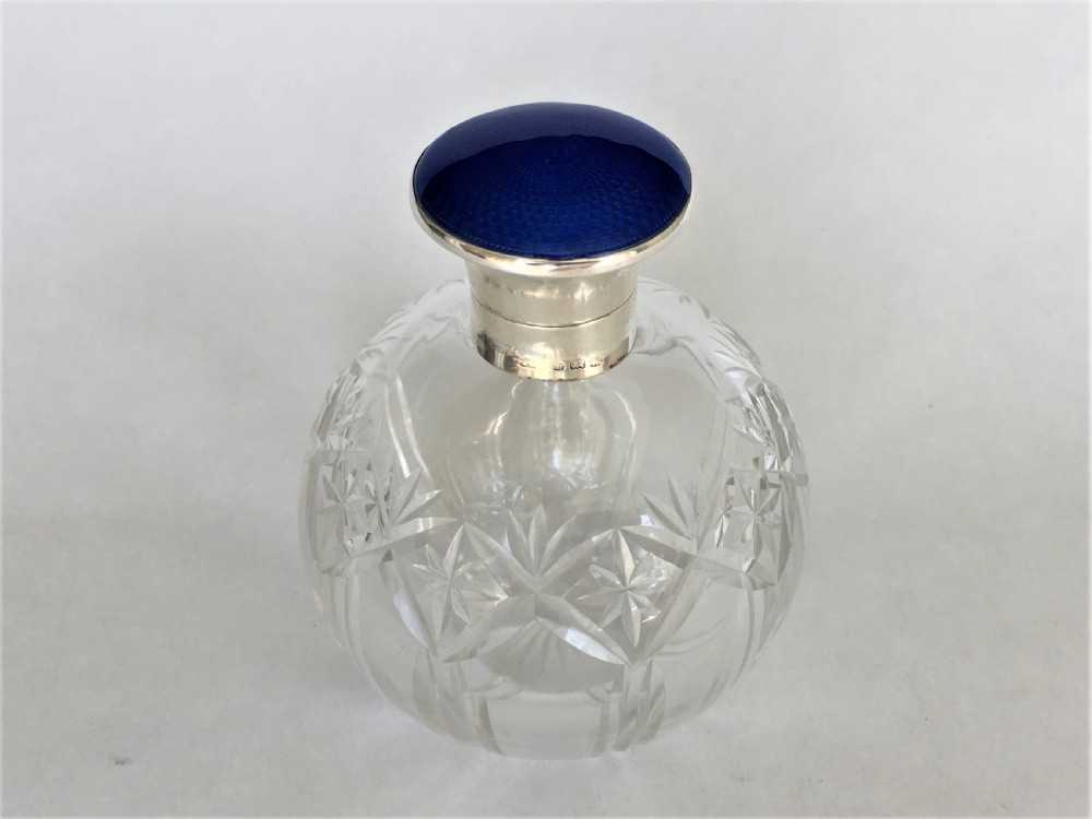 A silver & guilloche enamel cologne bottle