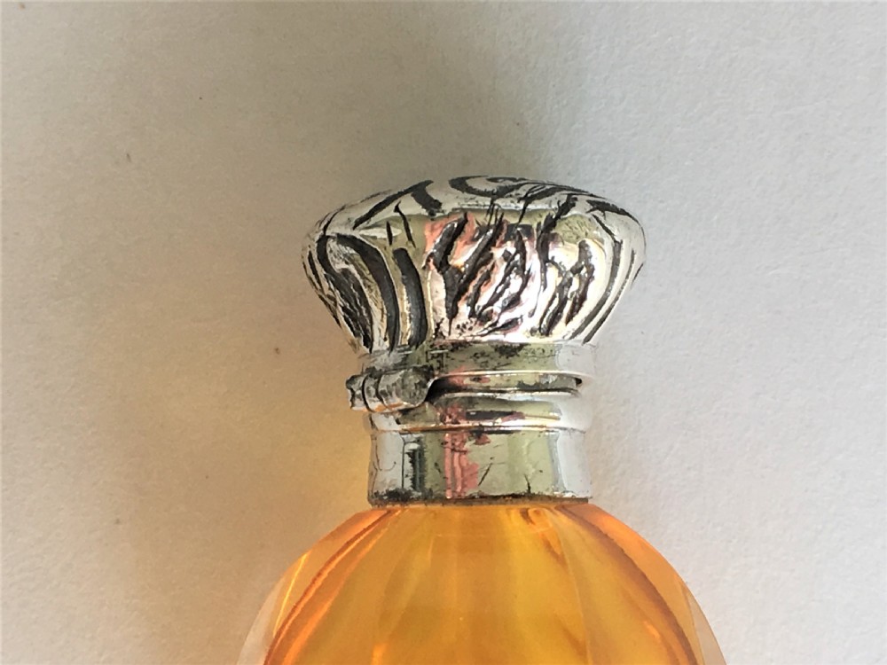 A charming silver mounted amber scent bottle View II
