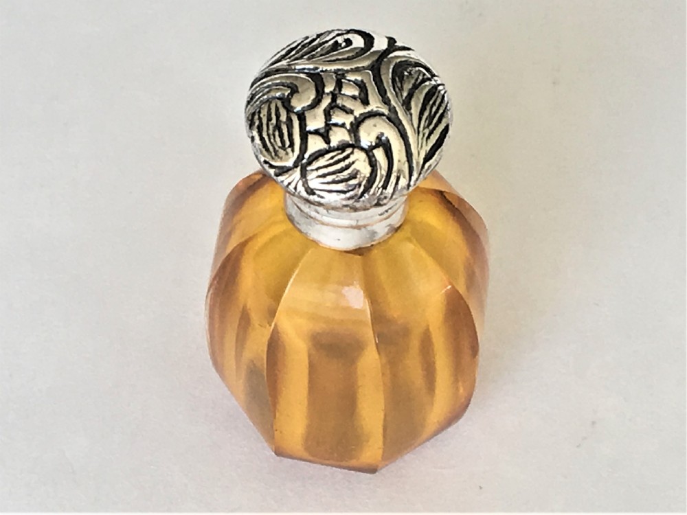 A charming silver mounted amber scent bottle View IV