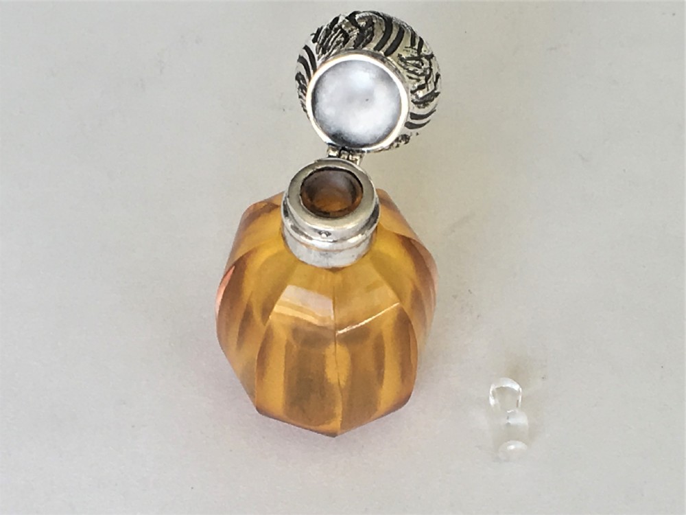 A charming silver mounted amber scent bottle View V