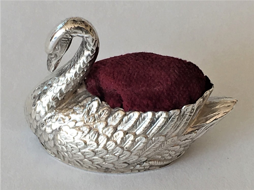 An Edwardian silver swan pin cushion
