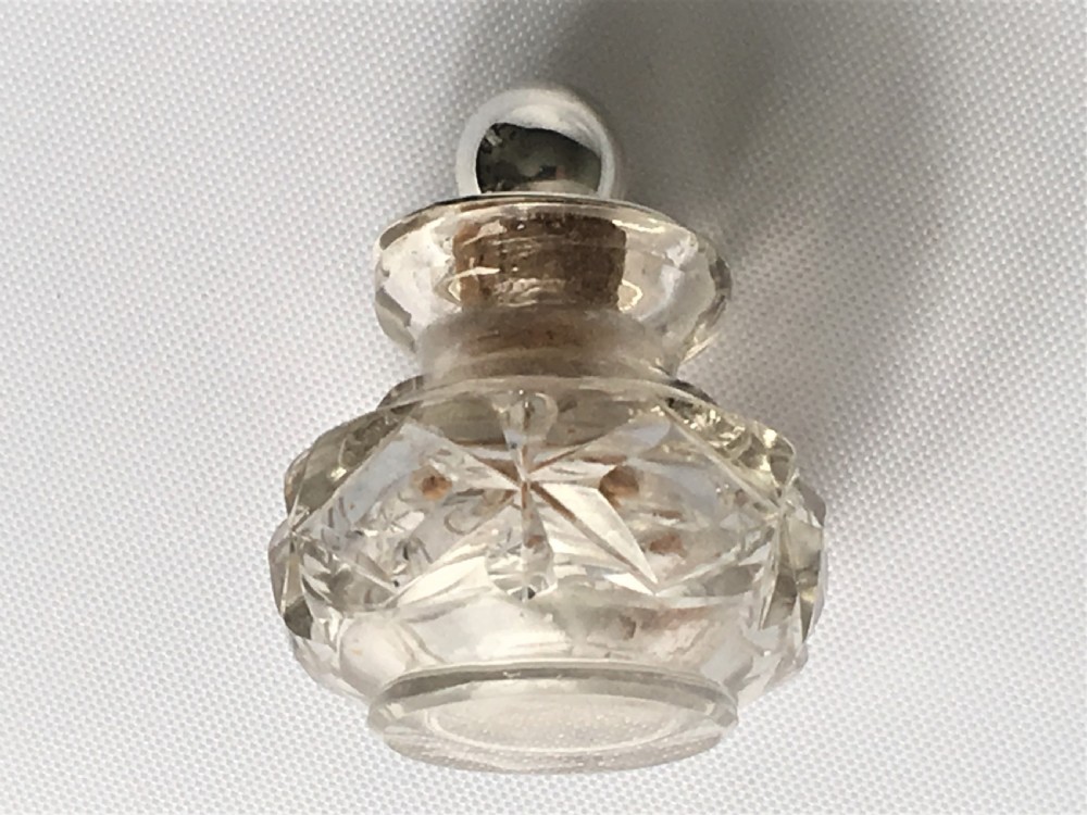 A pretty silver mounted cut glass scent bottle View II