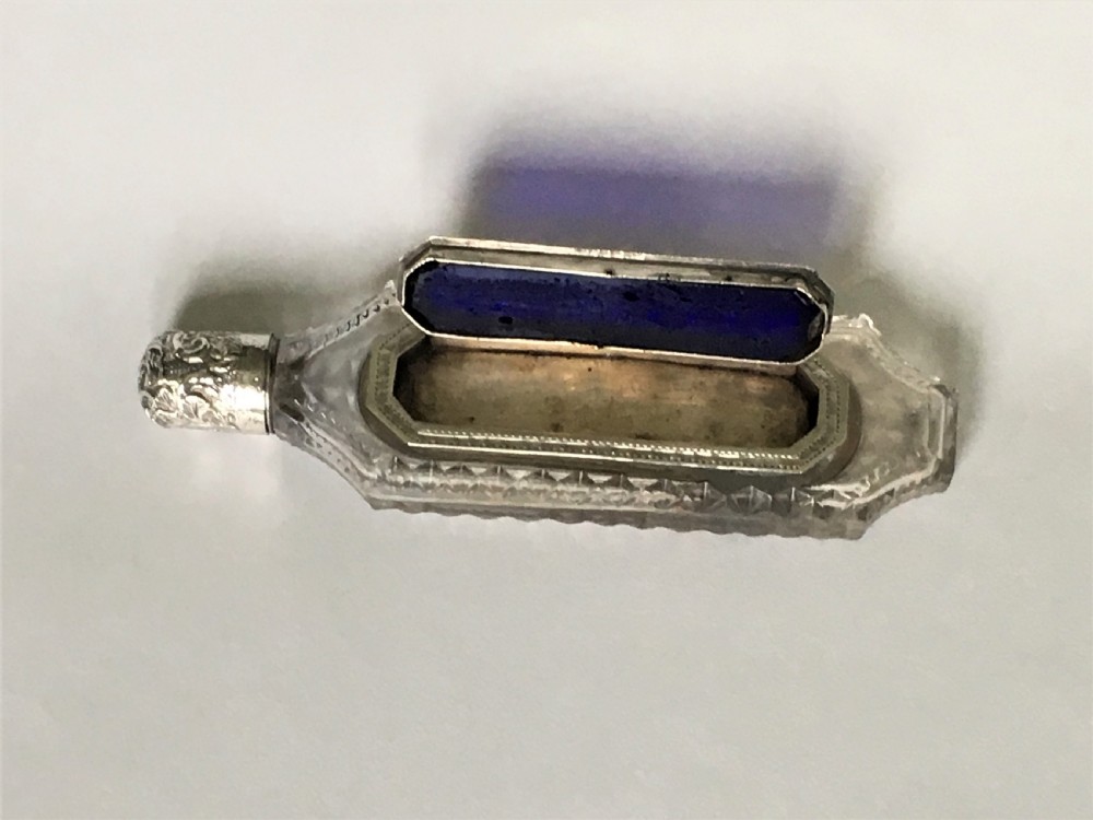 An unusual Victorian silver scent flask with memento compartment View III