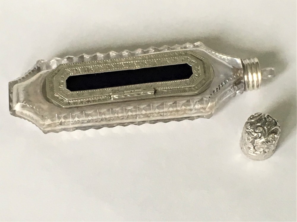An unusual Victorian silver scent flask with memento compartment View V