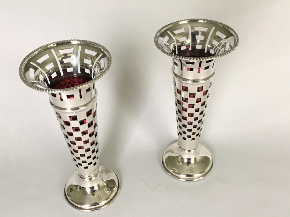 A gorgeous pair of silver & cranberry bud vases