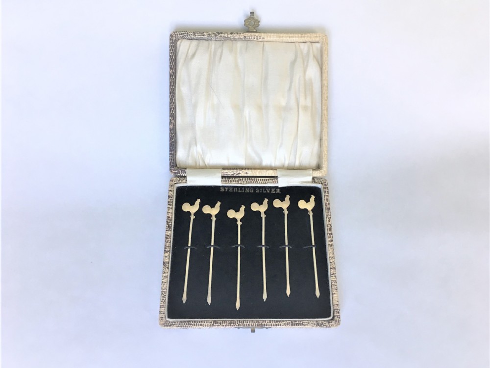 A set of silver gilt cockerel cocktail sticks View II