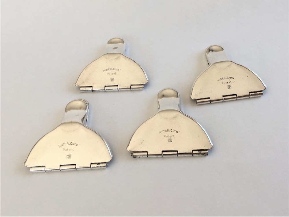 A rare set of 4 WMF silver plated lemon squeezers View III