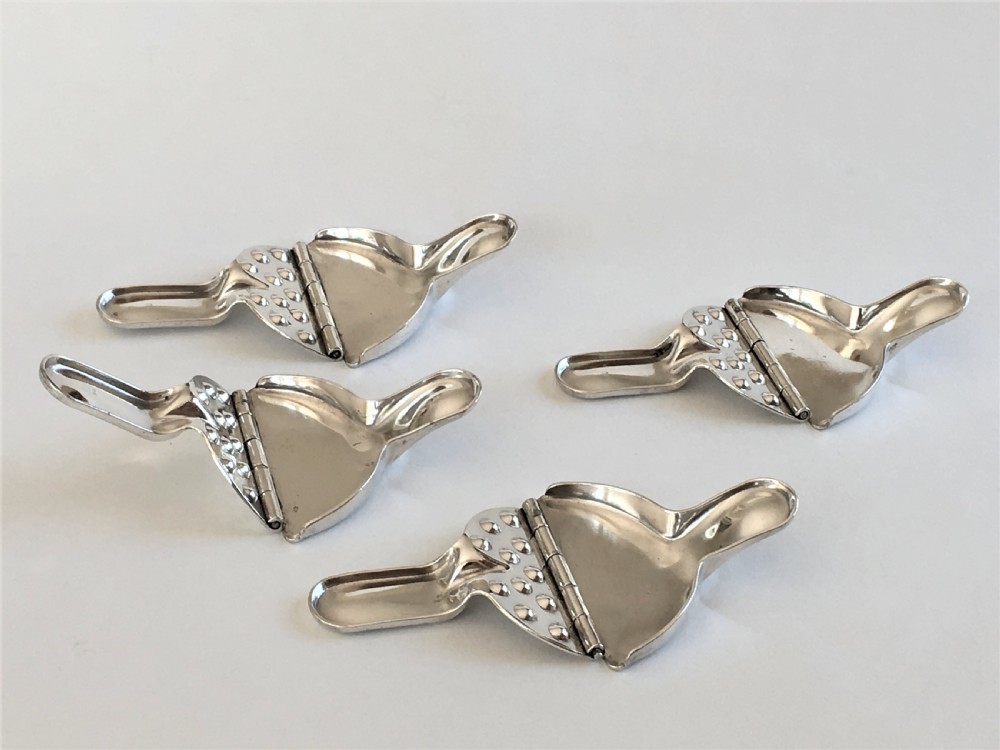 A rare set of 4 WMF silver plated lemon squeezers View V