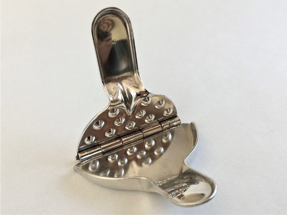 A rare set of 4 WMF silver plated lemon squeezers View VIII