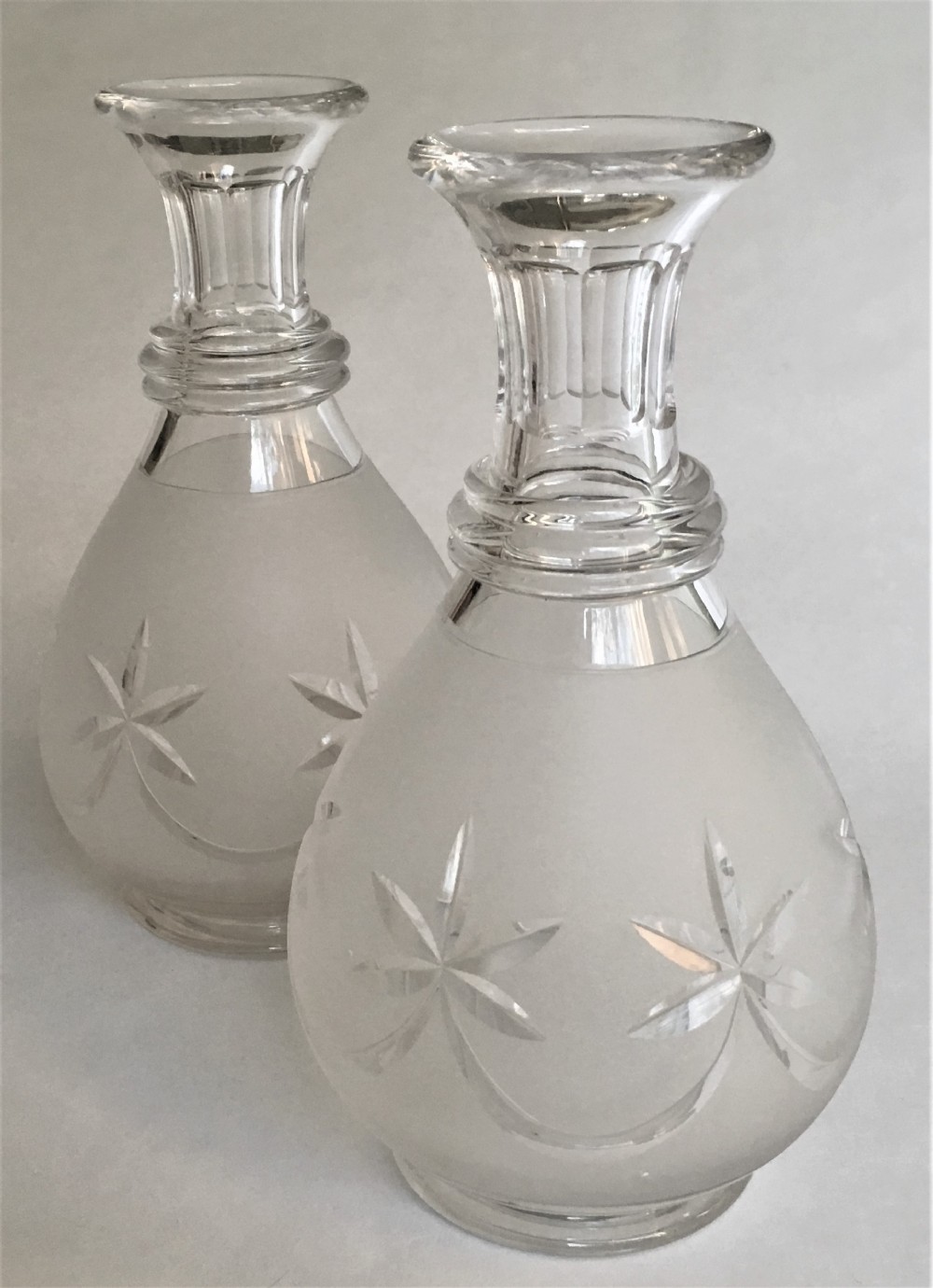 A handsome pair of Victorian frosted carafes