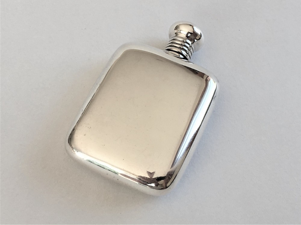 A charming 'one shot' silver hipflask