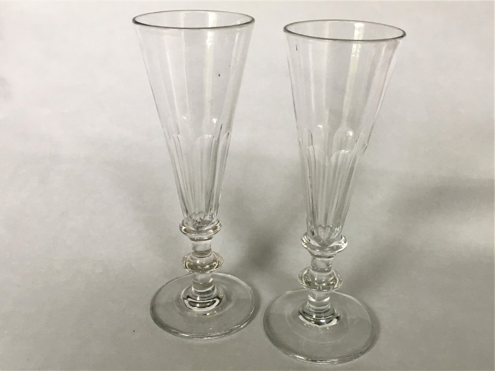 A pair of early Victorian cut glass champagne flutes