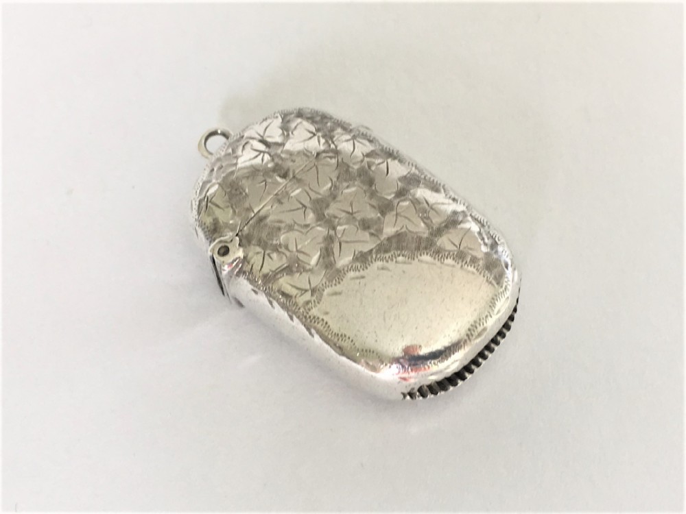 A Victorian ivy engraved silver vesta
