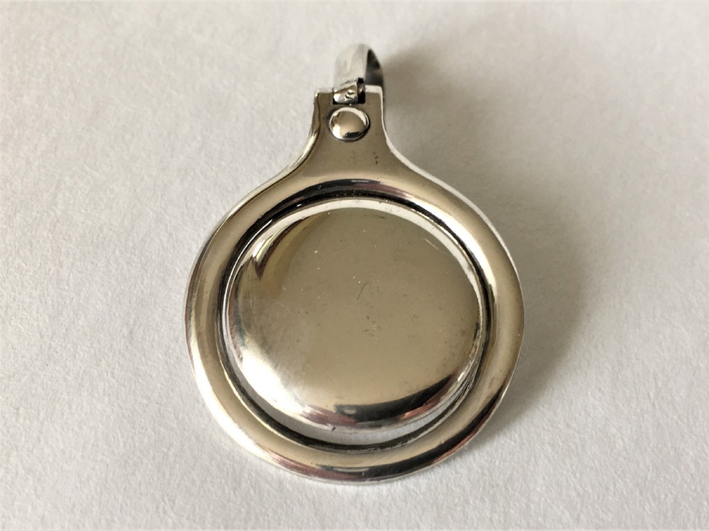 A Patented sprung silver napkin clip View II