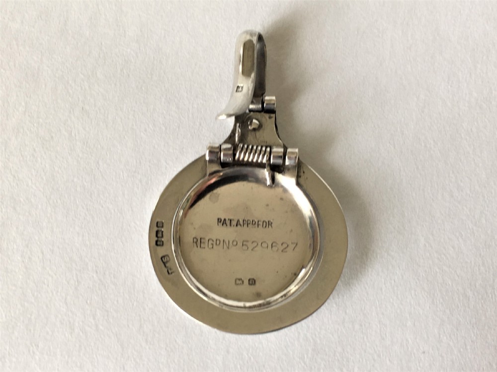 A Patented sprung silver napkin clip View III