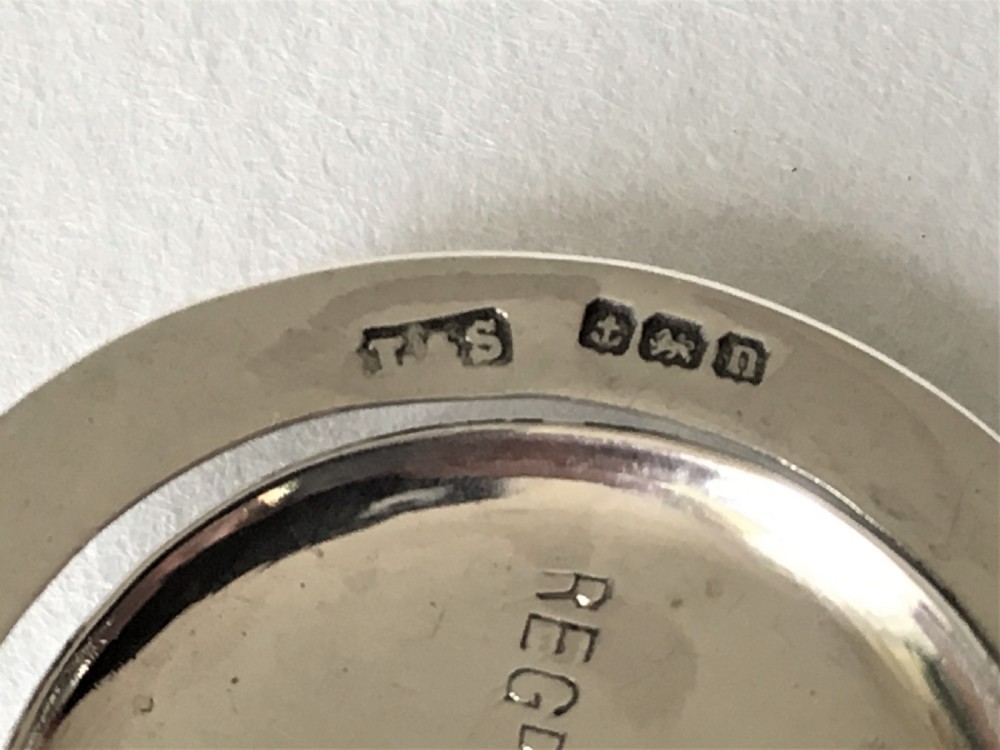 A Patented sprung silver napkin clip View IV