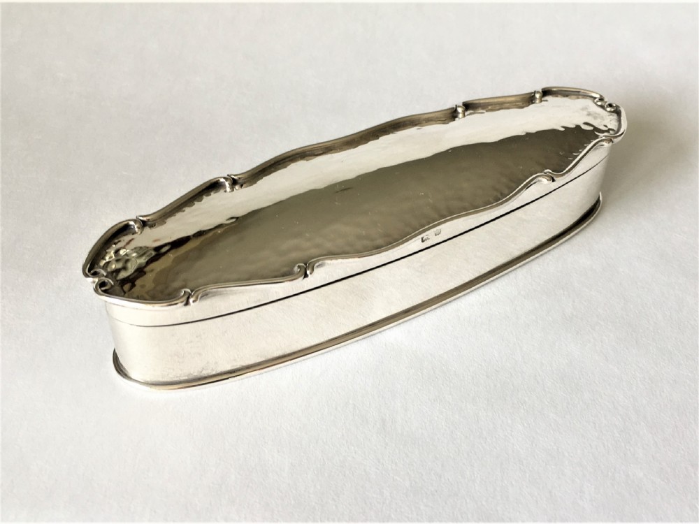 A superb Arts & Crafts hammered silver trinket box