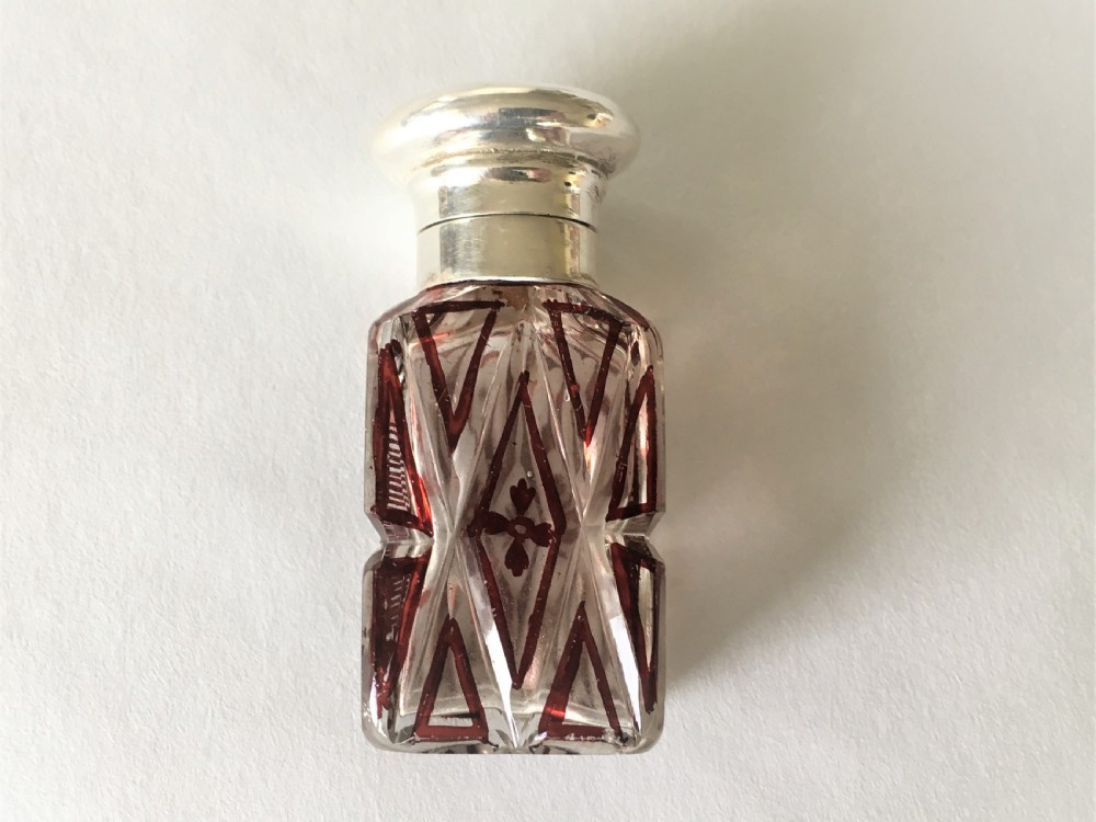 A charming silver mounted scent bottle