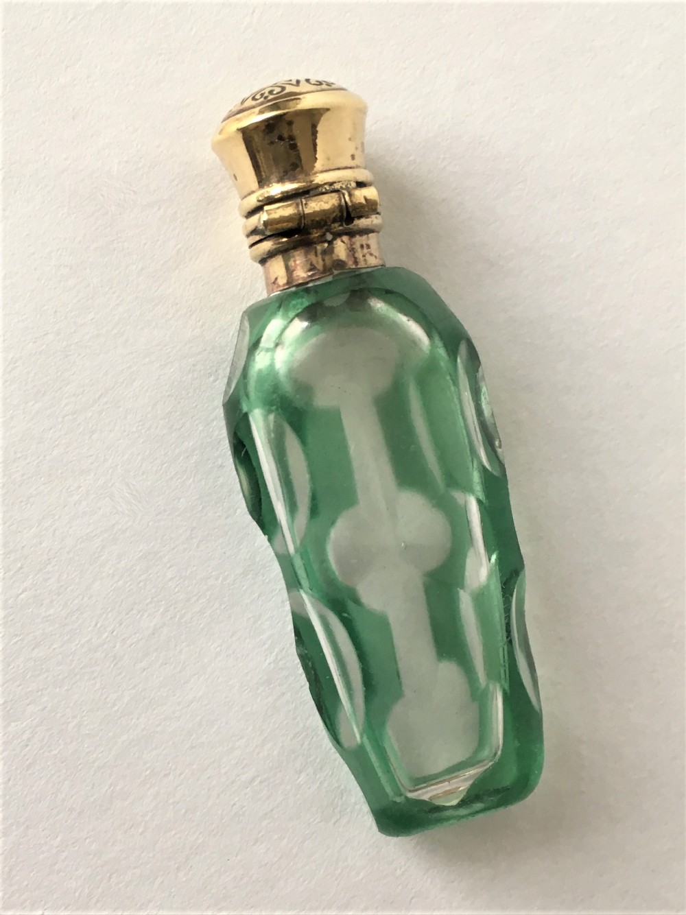A exquisite Victorian overlay scent bottle with gilt mount