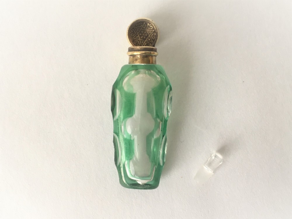A exquisite Victorian overlay scent bottle with gilt mount View V
