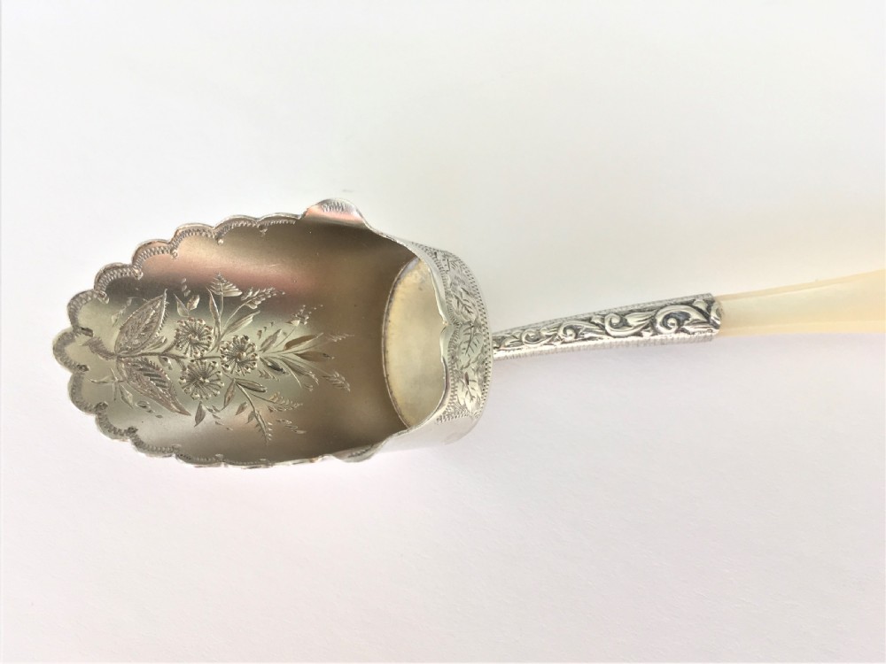 A pretty Victorian silver gilt caddy shovel View II