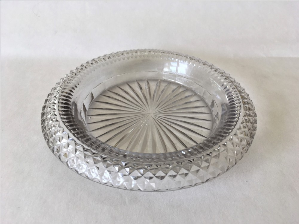 An extremely rare Regency cut glass decanter coaster