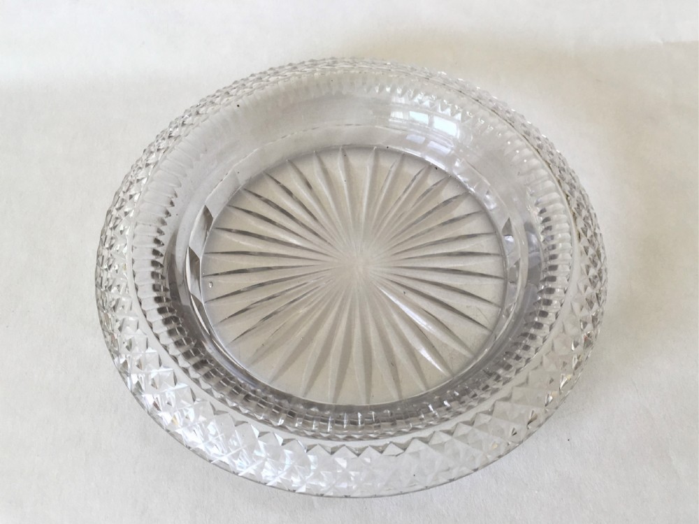 An extremely rare Regency cut glass decanter coaster View II