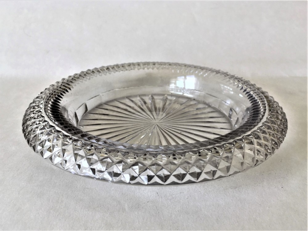 An extremely rare Regency cut glass decanter coaster View III