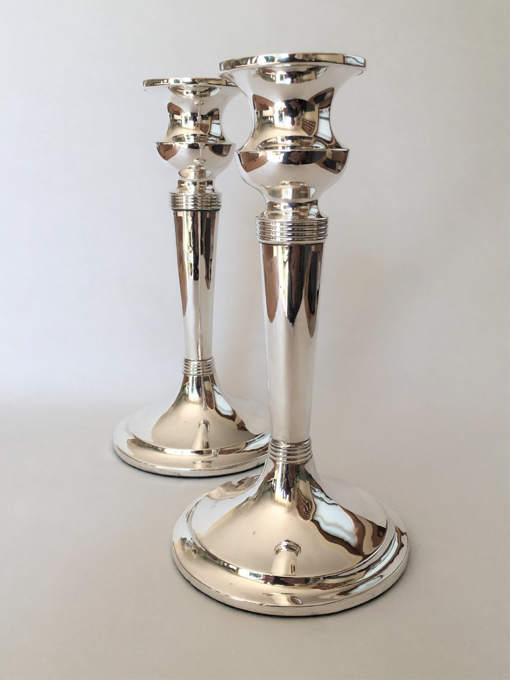 A handsome pair of Edwardian silver candlesticks View III