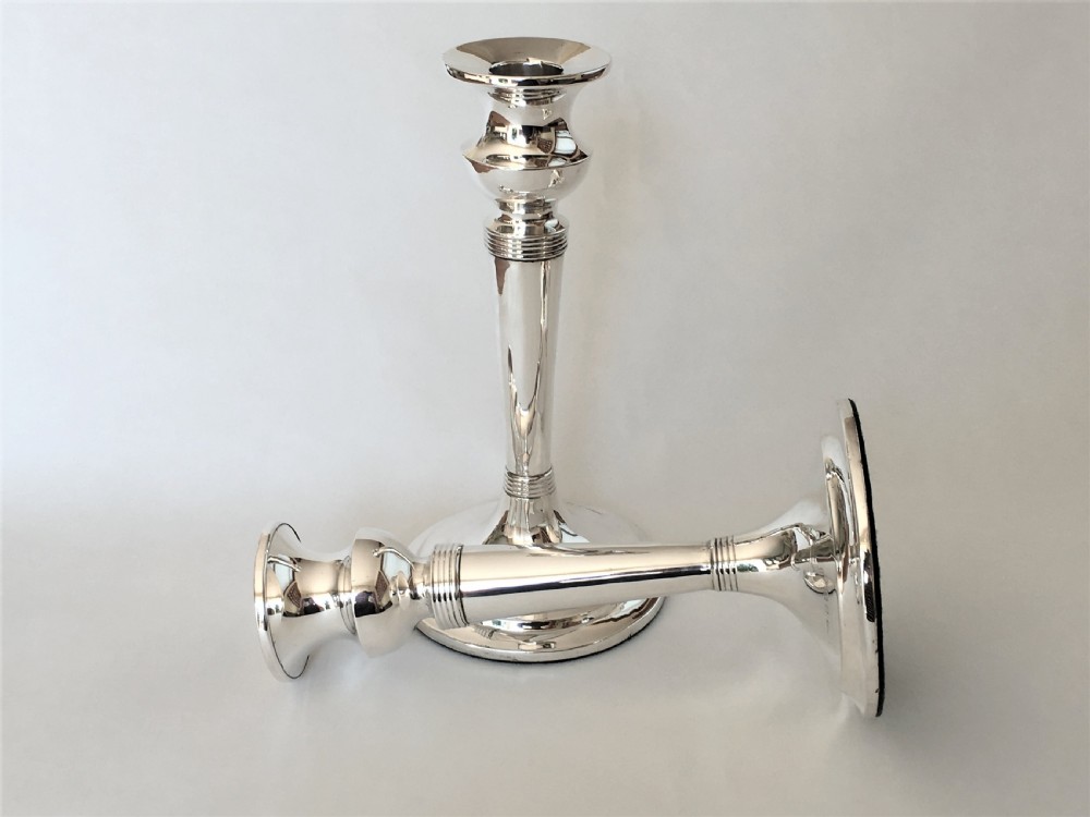 A handsome pair of Edwardian silver candlesticks View VI