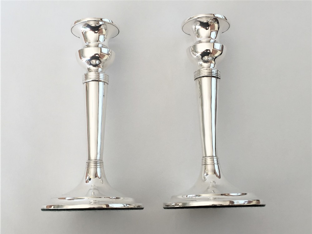 A handsome pair of Edwardian silver candlesticks View VII