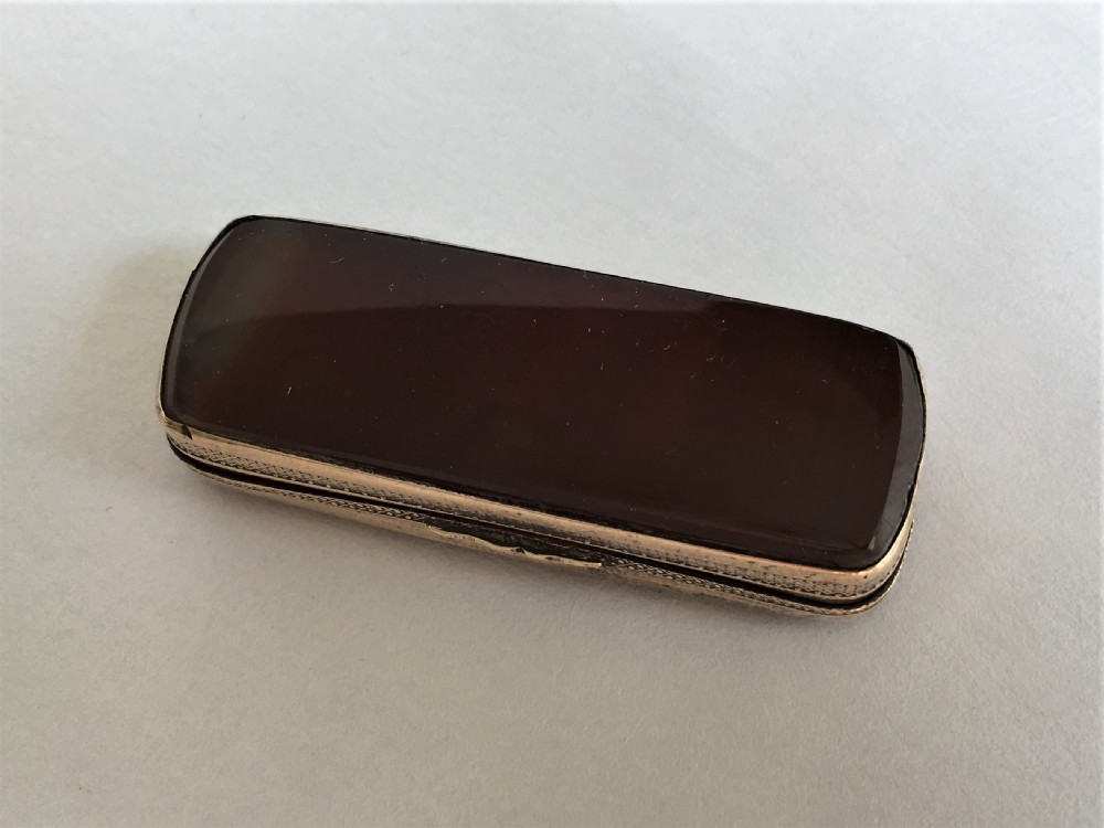 An early Victorian ormolu and agate snuff box View II