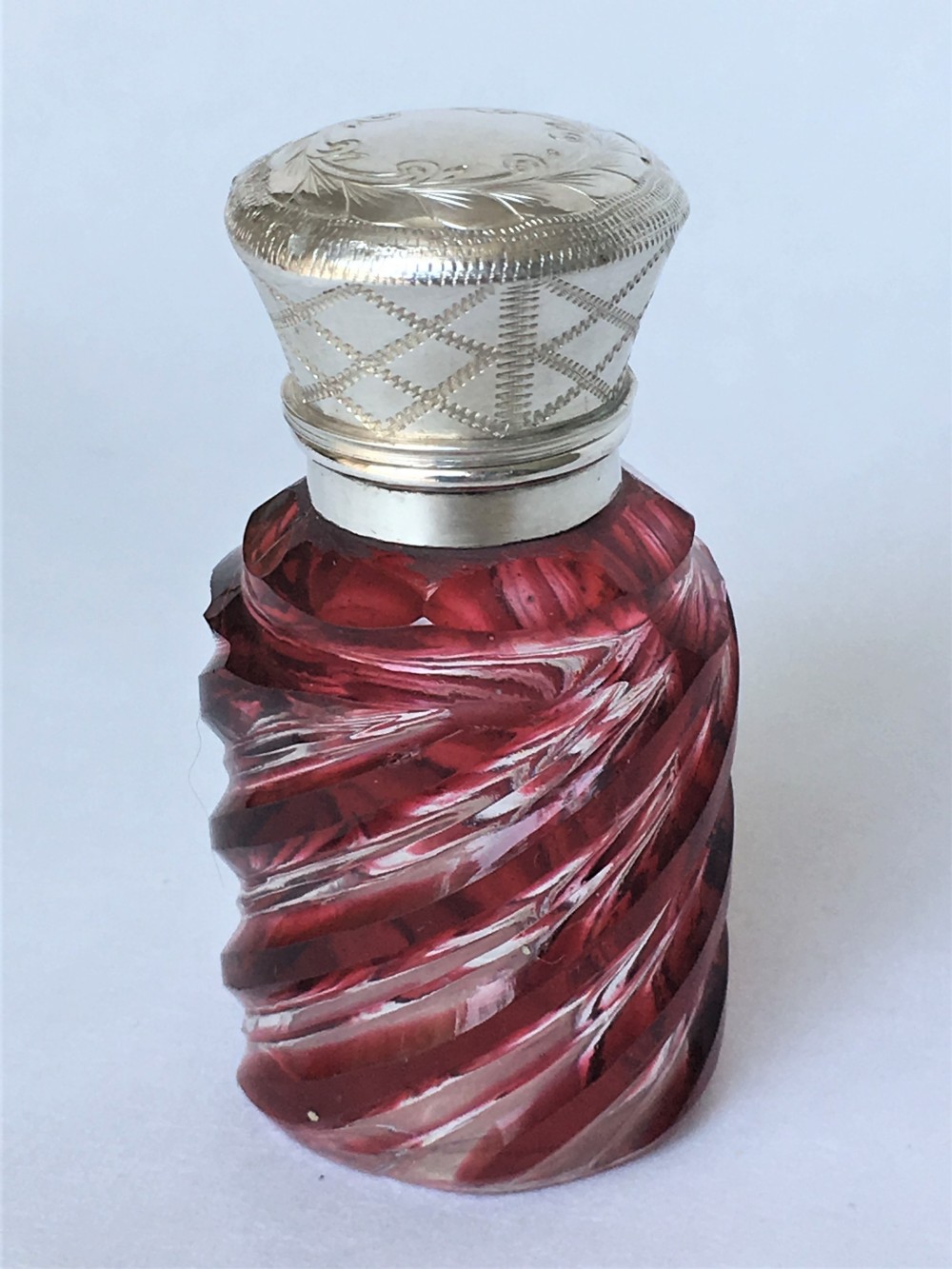 An unusual Victorian silver & cranberry scent bottle