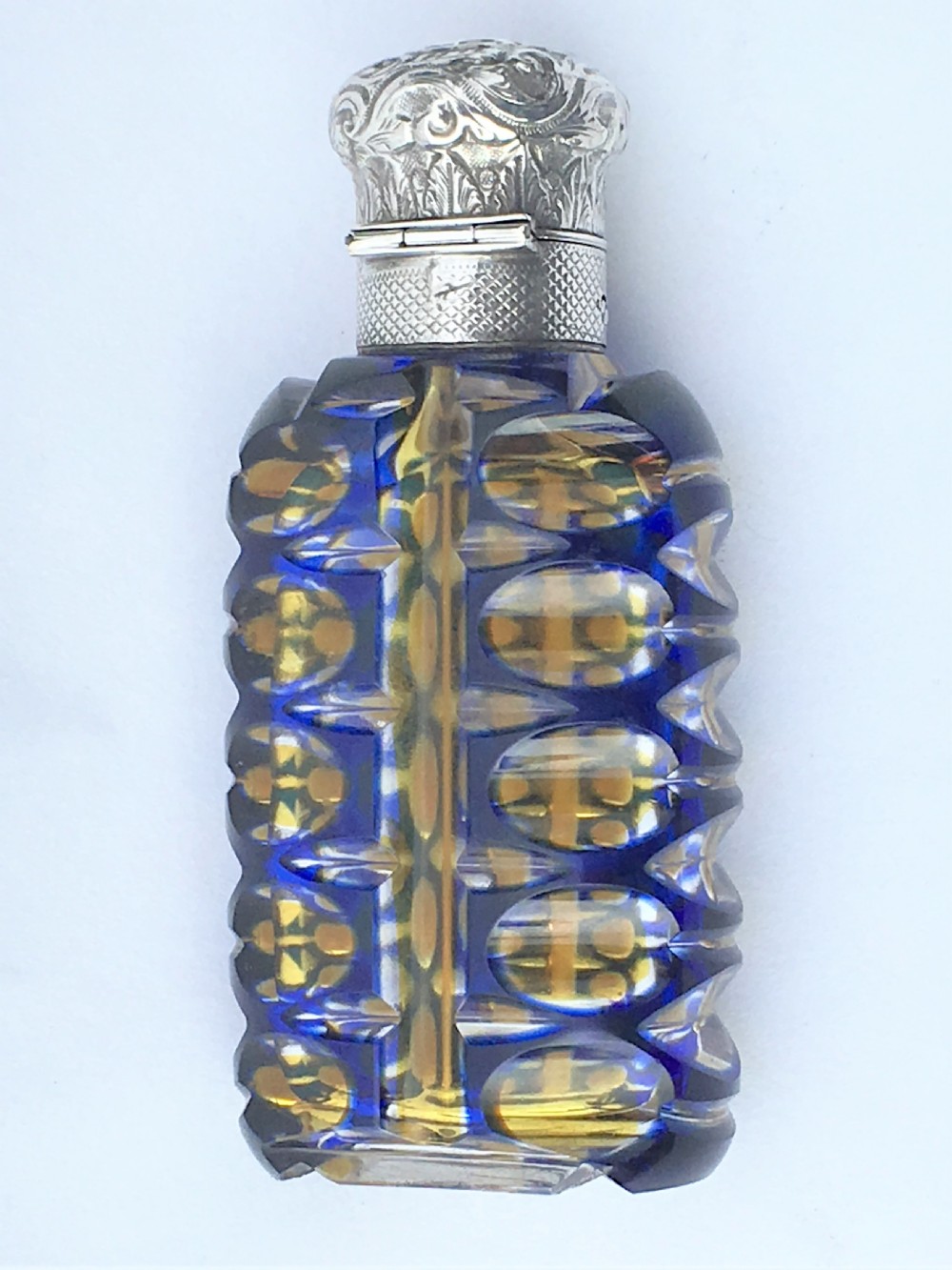 An outstanding double overlay silver mounted scent bottle