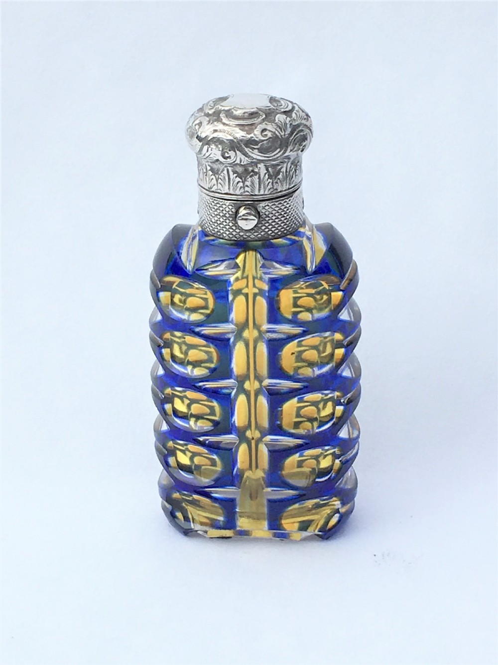 An outstanding double overlay silver mounted scent bottle View II