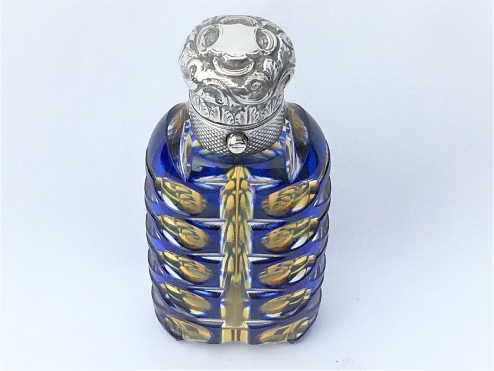 An outstanding double overlay silver mounted scent bottle View III