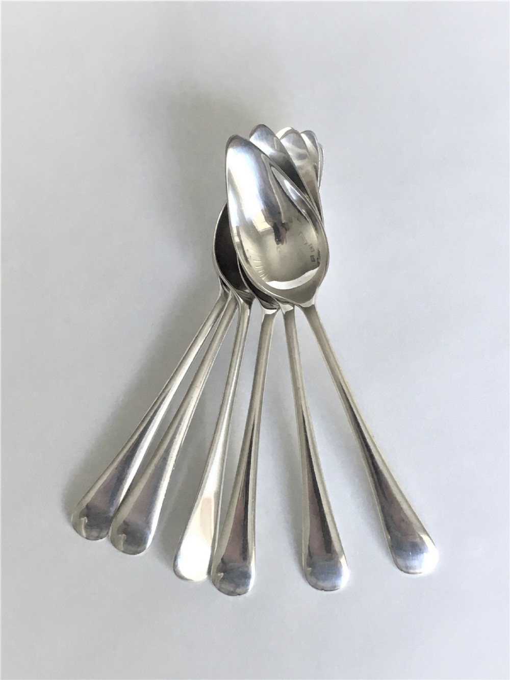 A rare set of six silver grapefruit spoons View II