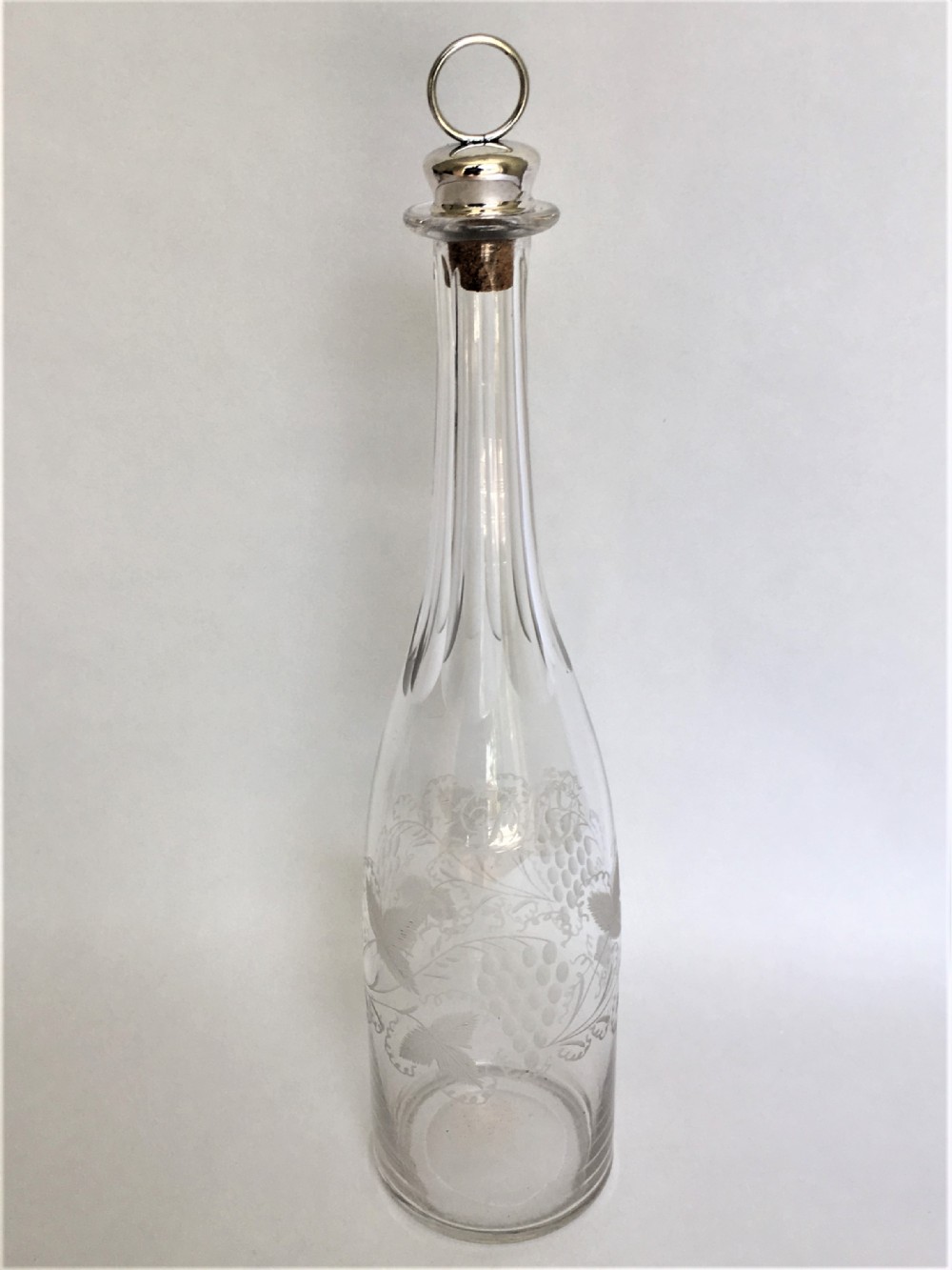 A Victorian etched wine bottle & silver stopper