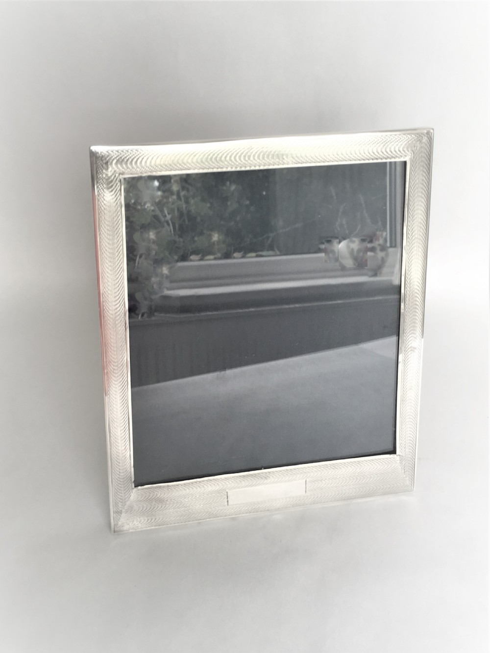 A large Art Deco silver photo frame