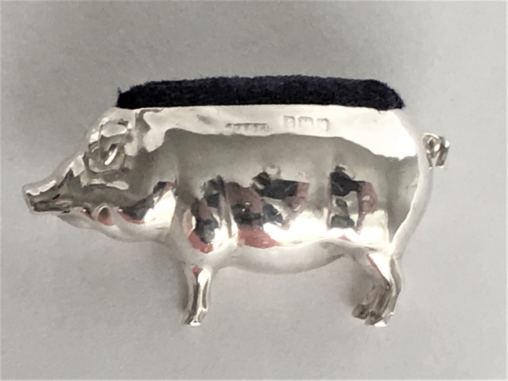 A wonderful Edwardian silver pig pin cushion