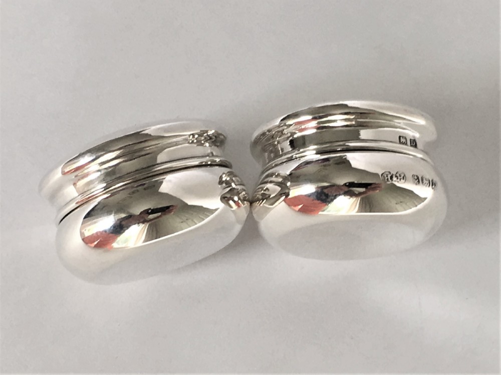 A pair of 'his & hers' silver pill boxes View II