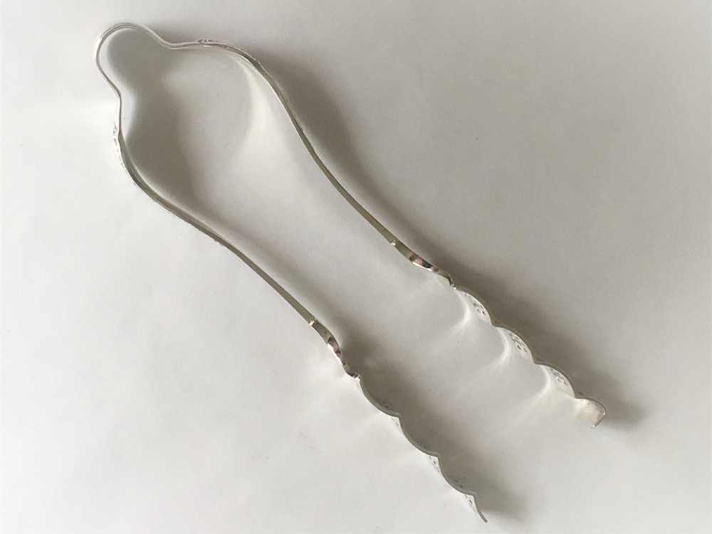 A fabulous pair of Victorian silver asparagus tongs View V