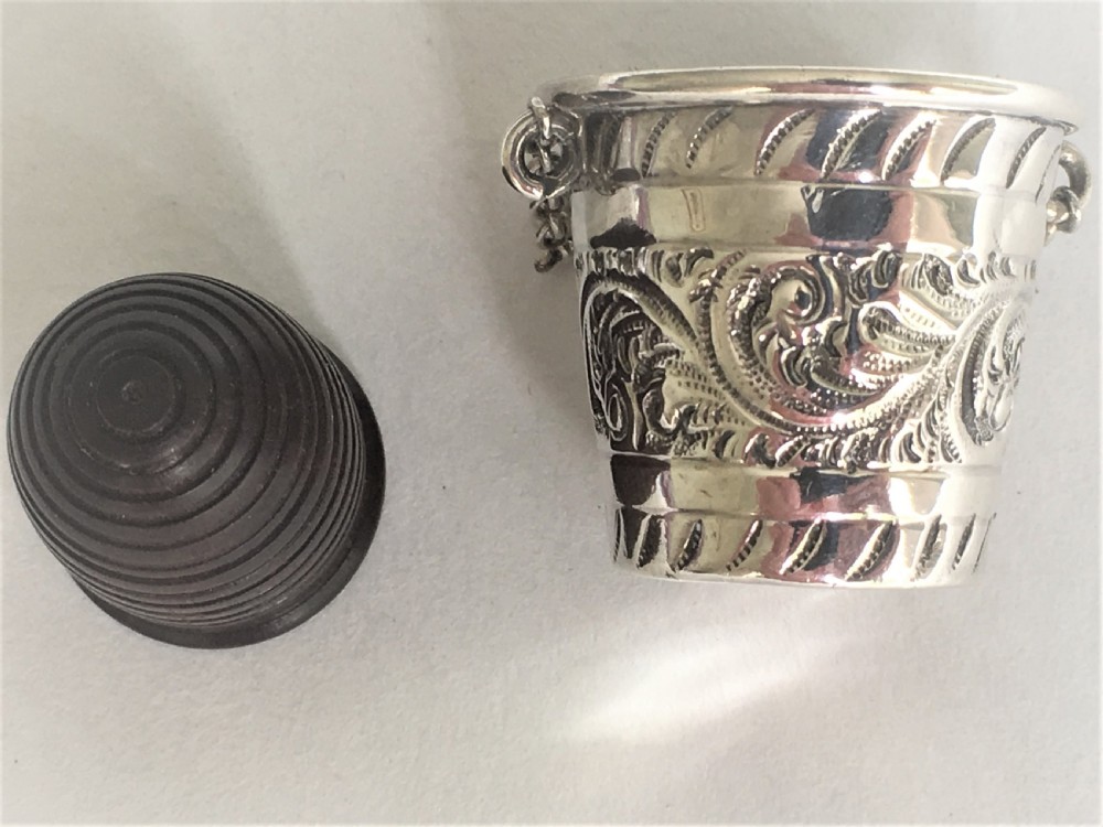An Edwardian silver thimble bucket and treen thimble View III