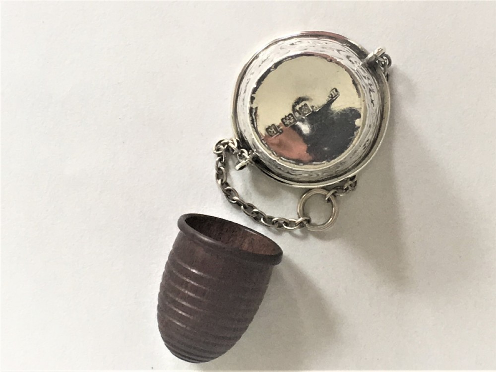 An Edwardian silver thimble bucket and treen thimble View V
