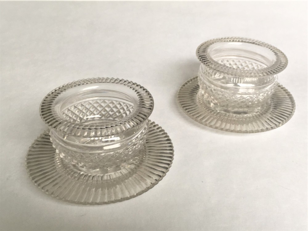 A fabulous pair of Regency glass condiment tubs & saucers