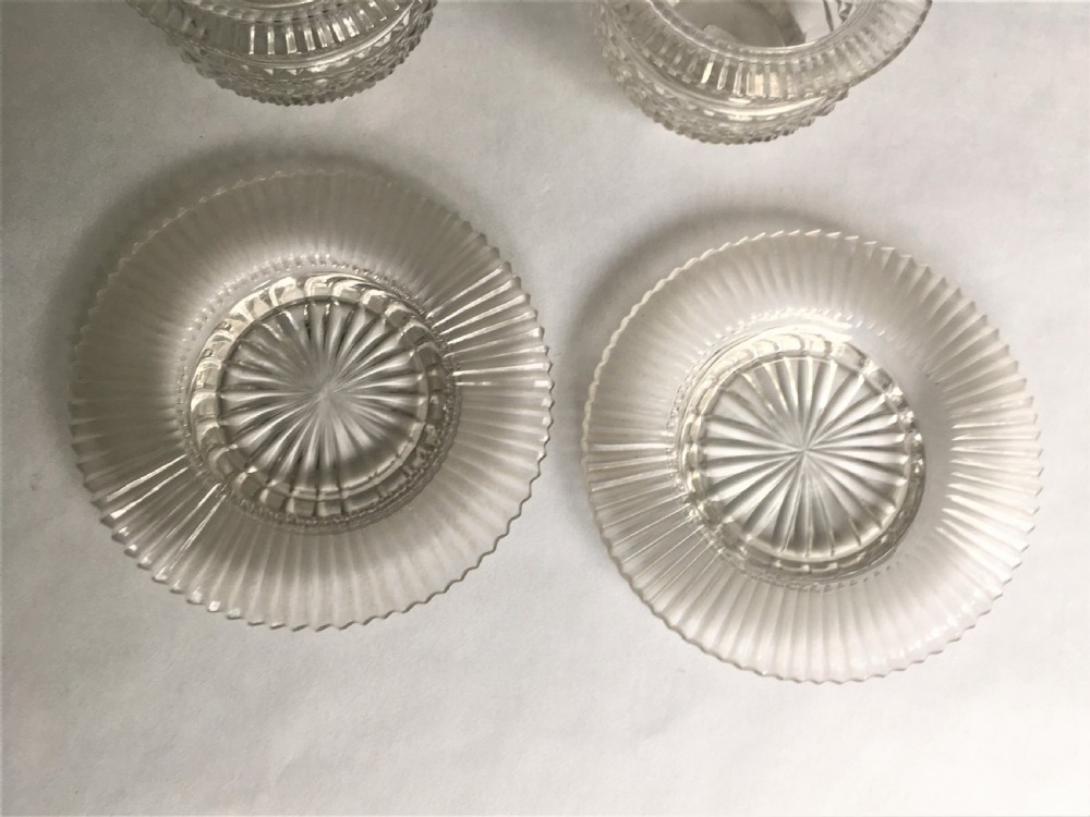A fabulous pair of Regency glass condiment tubs & saucers View V