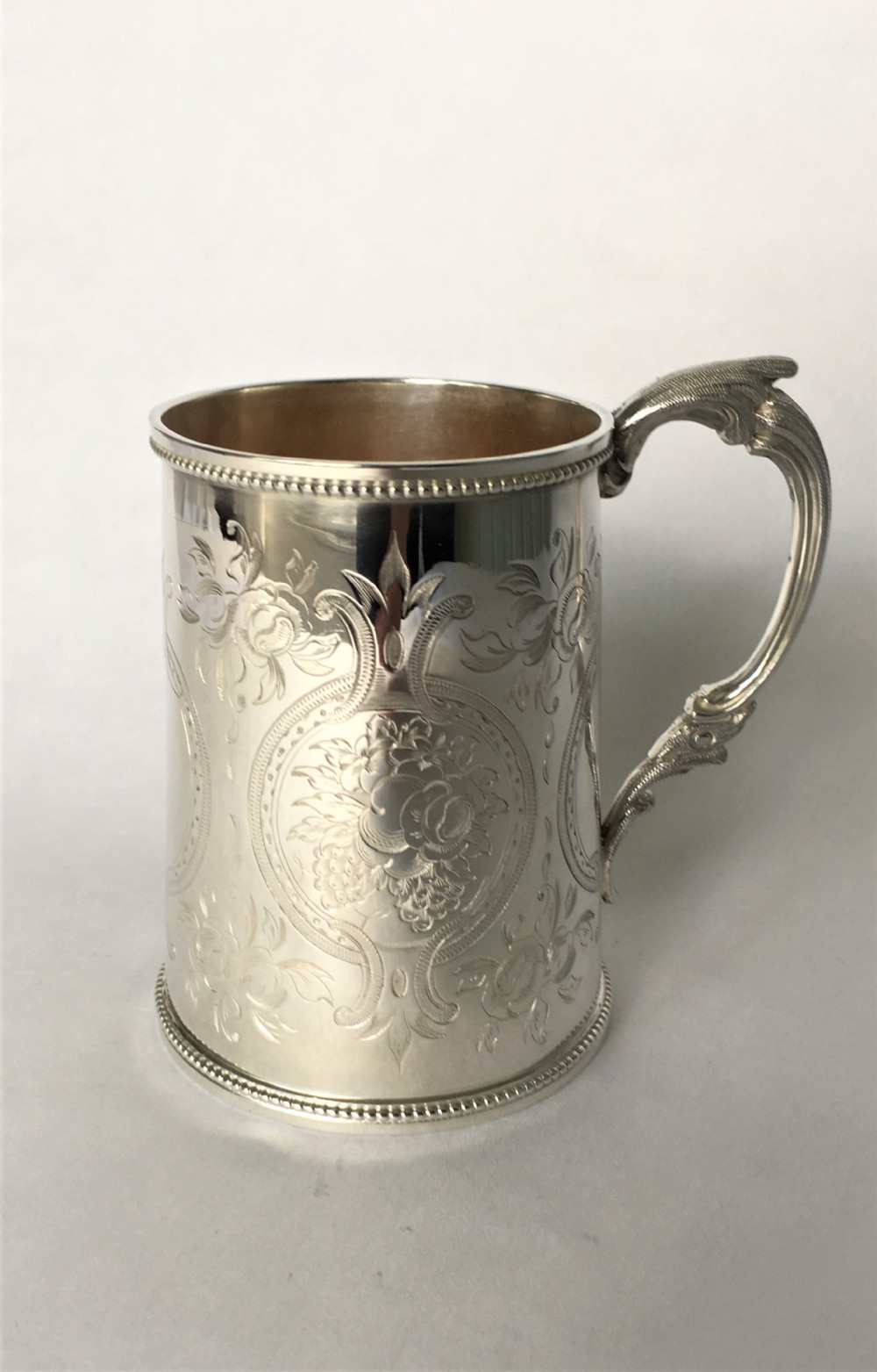 A fabulous Victorian silver gilt mug