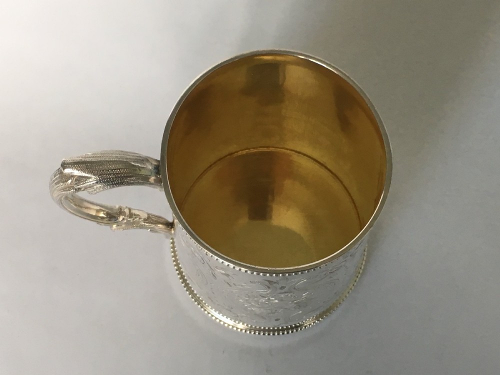 A fabulous Victorian silver gilt mug View VII