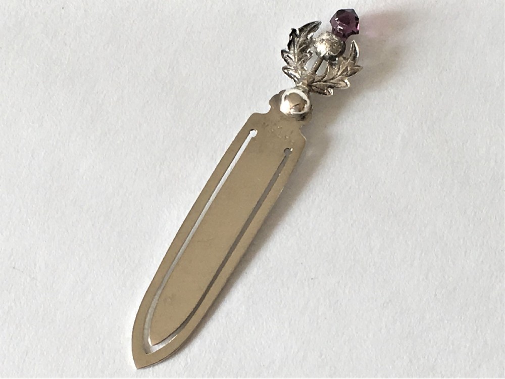 A delightful silver thistle bookmark