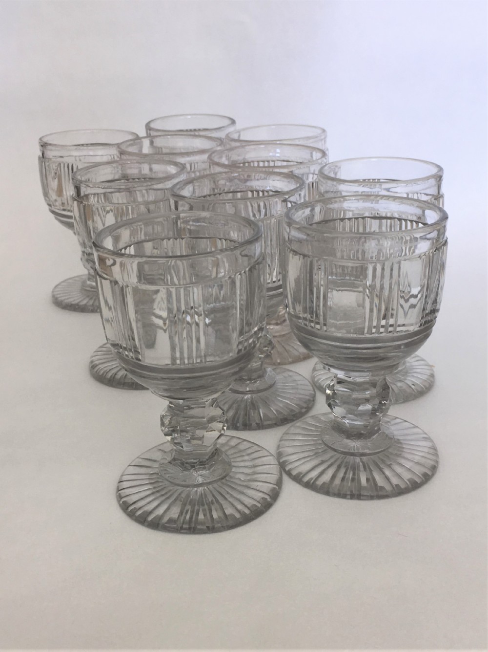 A handsome suite of 10 Victorian cut glass dessert wine glasses